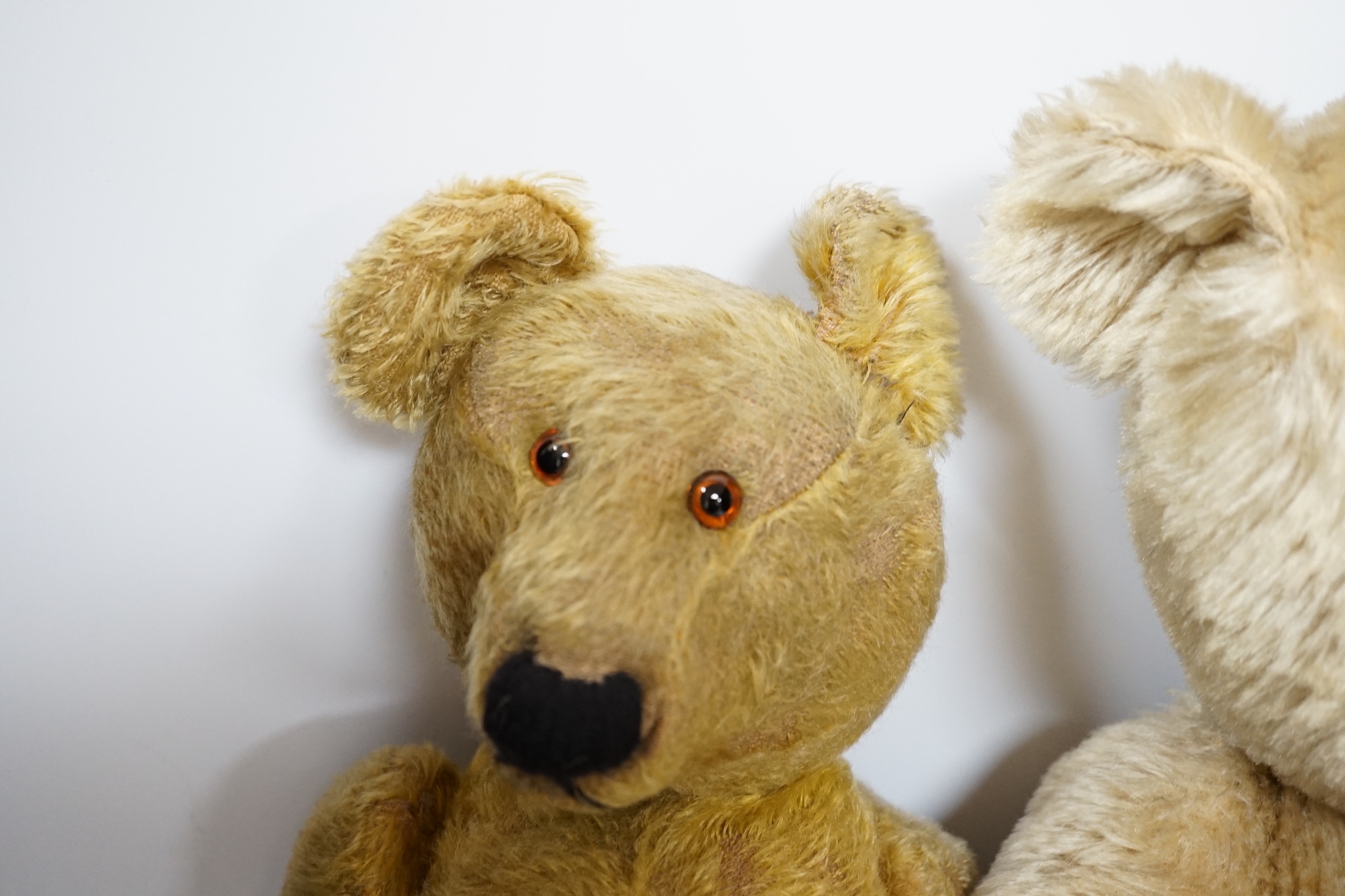 A Chiltern bear c.1950's, 55cm, tear to one velvet pad otherwise in good condition, and a 1930's bear, 50cm, repaired paw pads and nose